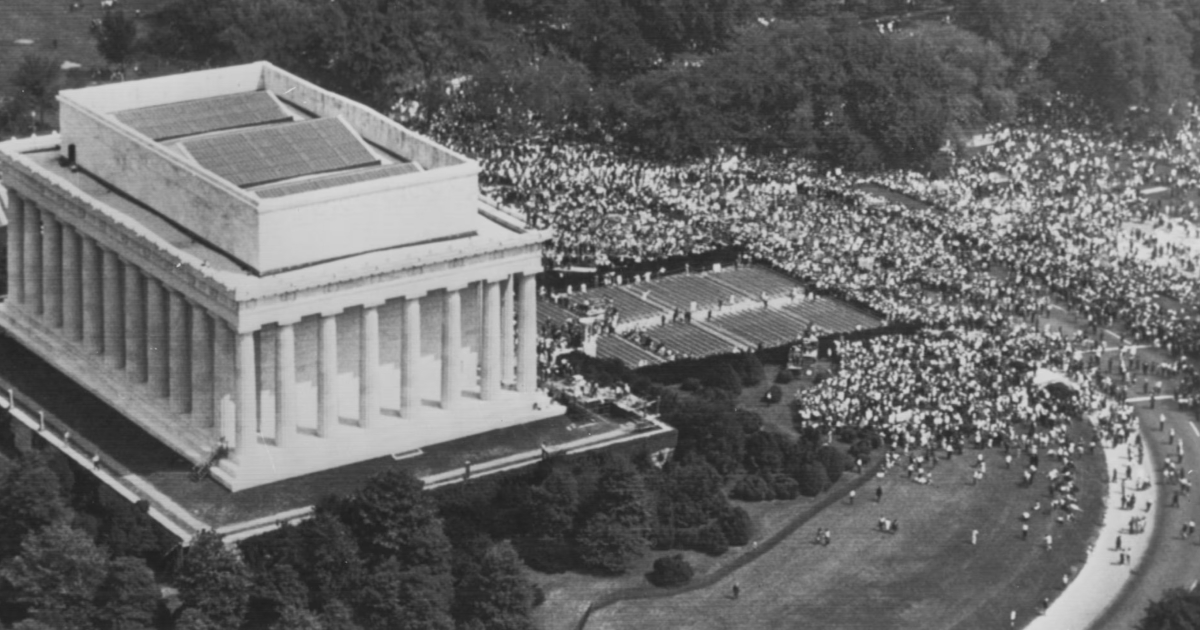 Aerial photograph of the August 28, 1963 March on Washington, with a crowd of 250,000 gathered along the Reflecting Pool from the Lincoln Memorial to the Washington Monument.