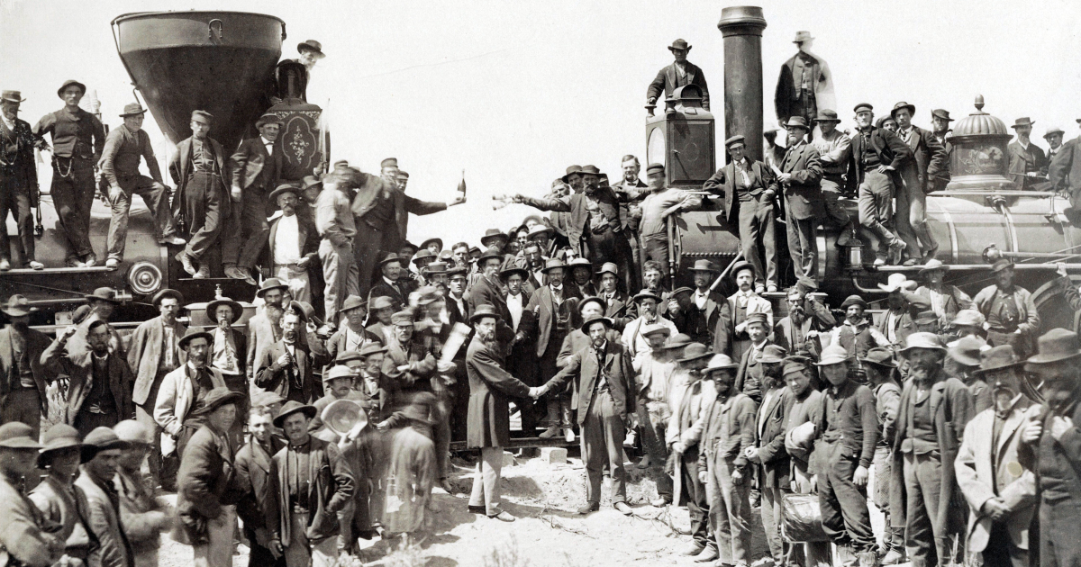 Andrew J. Russell’s 1869 photograph “East and West Shaking Hands at Laying of Last Rail” at Promontory Summit, Utah.